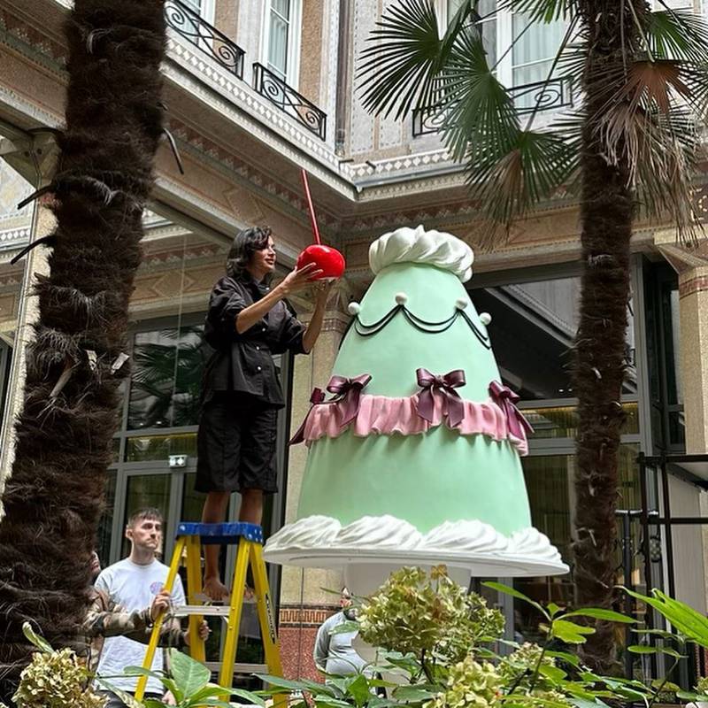 Egyptian artist Laila Gohar adds the final touch to one of her oversized cake sculptures. Photo: @lailacooks / Instagram