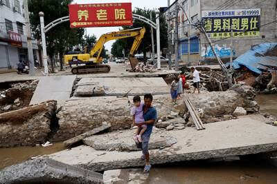 A bridge damaged after rain and flooding brought by remnants of Typhoon Doksuri, in Zhuozhou, China's Hebei province. Reuters
