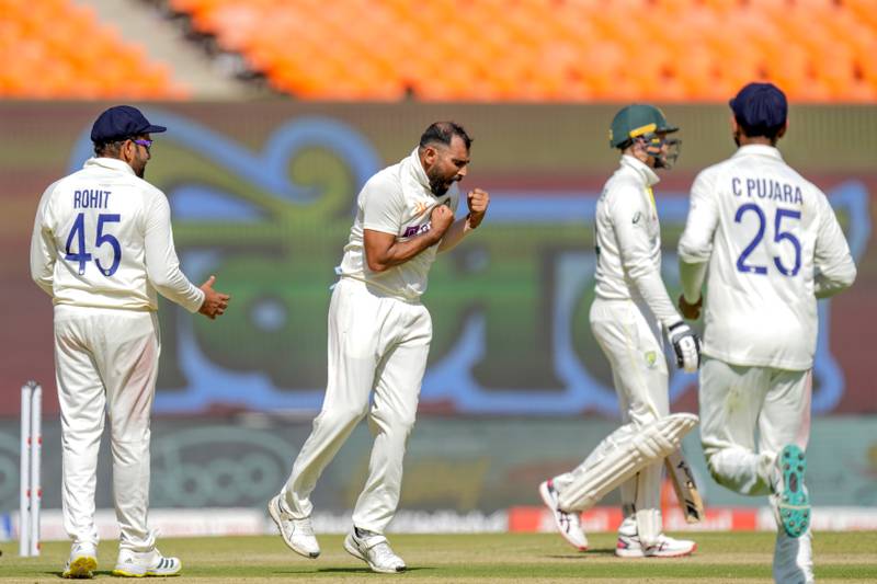 India bowler Mohammed Shami, second left, celebrates with teammates after the dismissal of Australia's Peter Handscomb for 17. AP