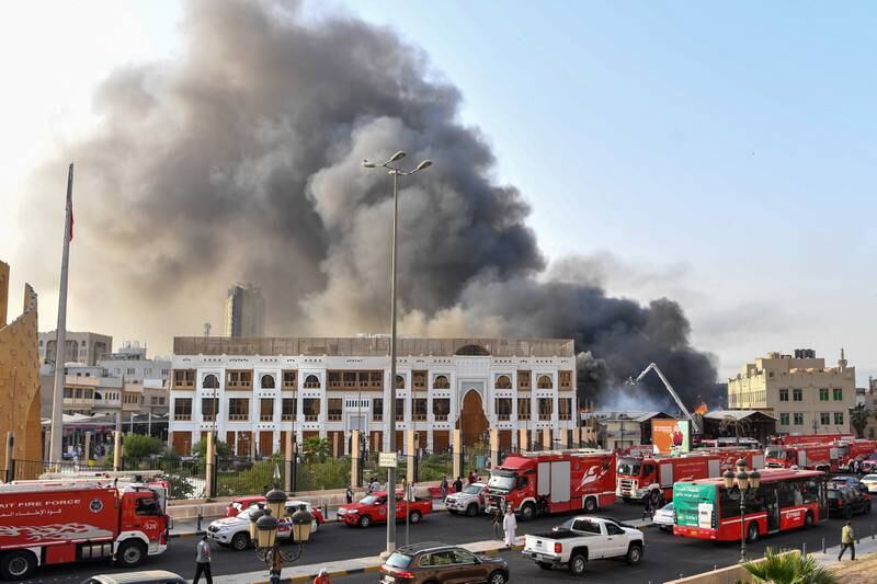 Plumes of smoke at the site of a fire that broke out on Thursday at Mubarakiya souq in Kuwait City. EPA