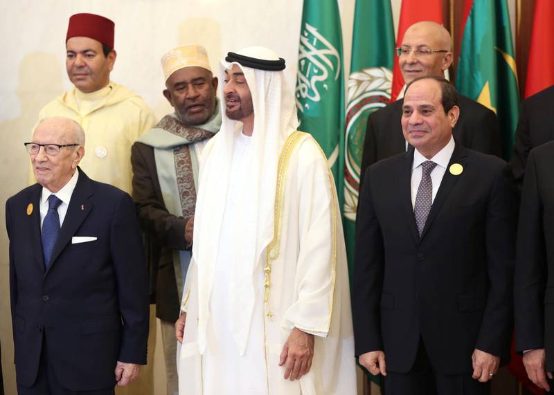 Tunisian President Beji Caid Essebsi , Abu Dhabi's Crown Prince Sheikh Mohammed bin Zayed al-Nahyan and Egyptian President Abdel Fattah al-Sisi stand during a group photo with Arab leaders, ahead of the Arab Summit in Mecca, Saudi Arabia May 31, 2019. REUTERS/Hamad l Mohammed