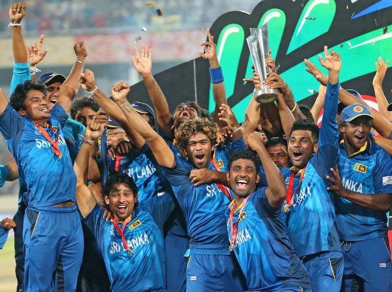 Lasith Malinga and his Sri Lankan teammates celebrate with the trophy after winning the 2014 T20 World Cup final against India in Dhaka. Getty