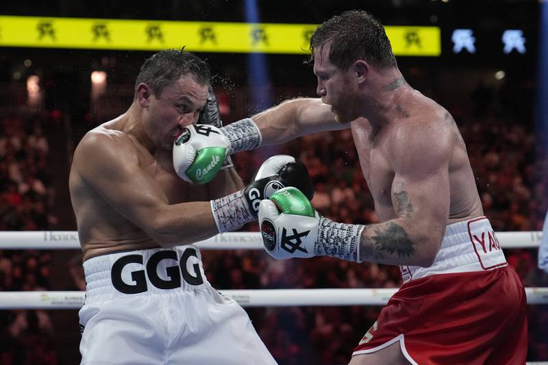 Canelo Alvarez lands a punch on Gennady Golovkin. AP