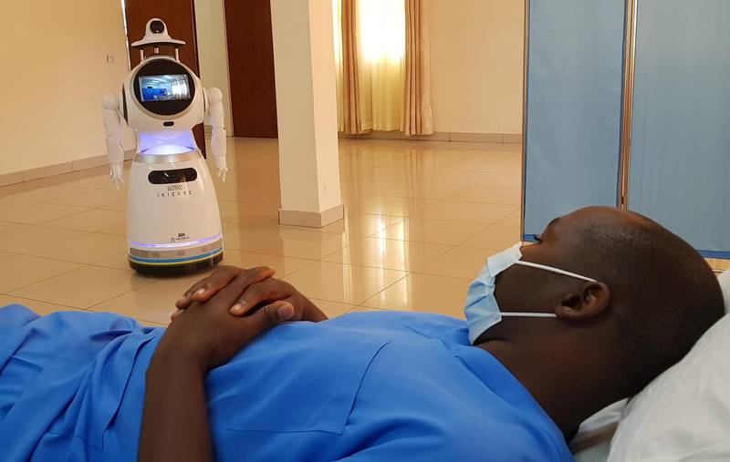 A robot prepares to check the temperature of a health worker during the demonstration. Reuters