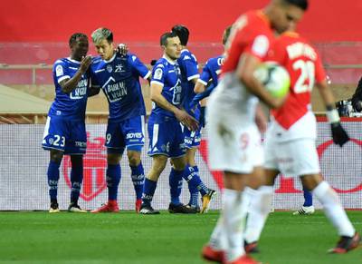 Troyes' South Korean forward Hyun-Jun Suk (2L) celebrates with teammates after scoring a free kick during the French L1 football match AS Monaco (ASM) vs Troyes AC (ESTAC) at the Louis II  Stadium in Monaco on December 9, 2017. (Photo by YANN COATSALIOU / AFP)