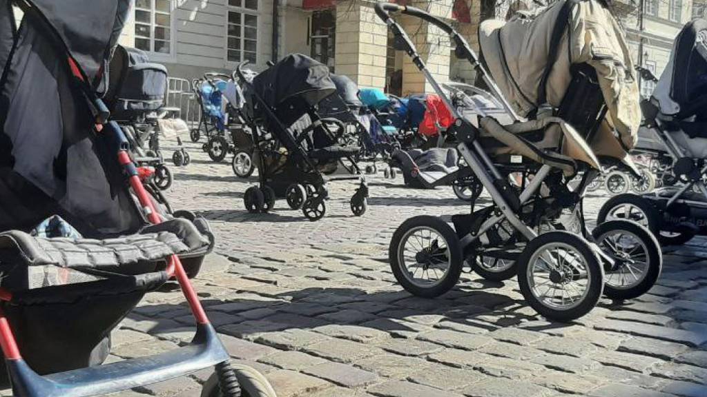Dozens of prams in Lviv square honour children killed in Russian invasion