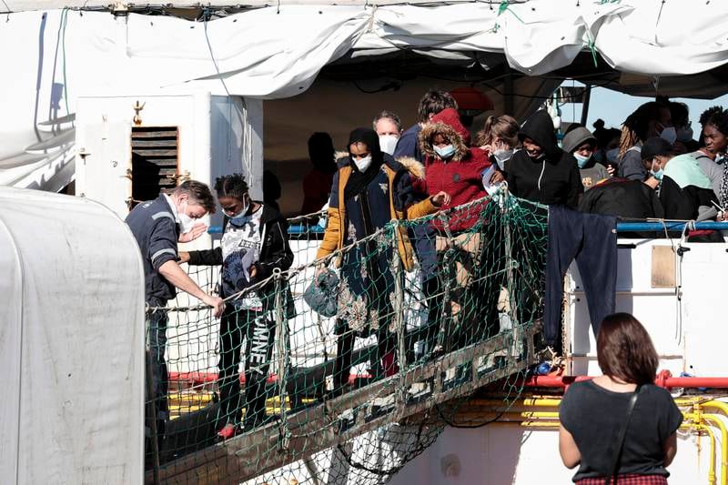 Some of the 440 migrants disembark from ‘SeaWatch 3’ in Pozzallo, Sicily. EPA