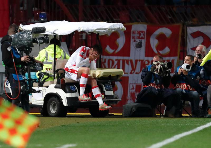 Red Star's Milan Pavkov is transported off the pitch after picking up an an injury. AP