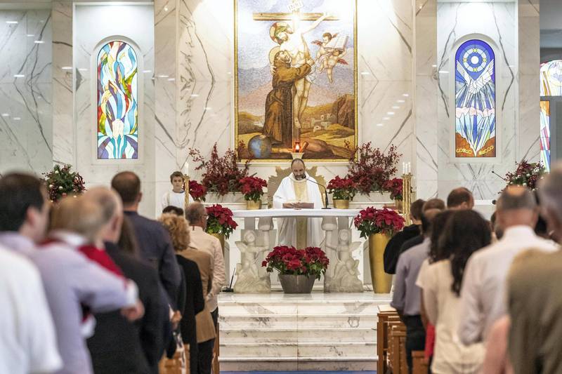 DUBAI, UNITED ARAB EMIRATES. 25 DECEMBER 2018. Coverage of Christmas Day Mass at St Francis Church in Jebel Ali. Italian Mass service. (Photo: Antonie Robertson/The National) Journalist: Patrick Ryan. Section: National.