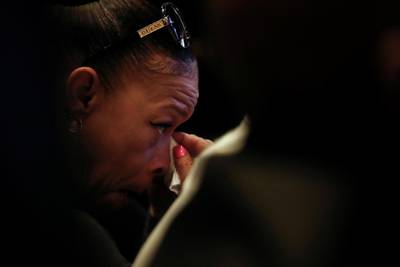 A woman wipes away tears during a memorial service for George Floyd following his death in Minneapolis police custody, in Minneapolis, Minnesota. Reuters