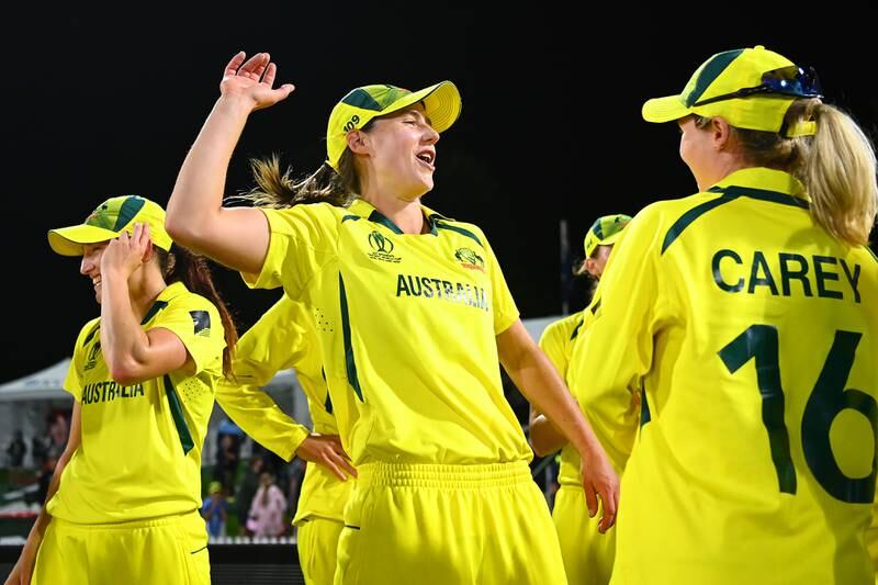 Ellyse Perry celebrates with teammates after Australia win the 2022 Women's Cricket World Cup. Getty