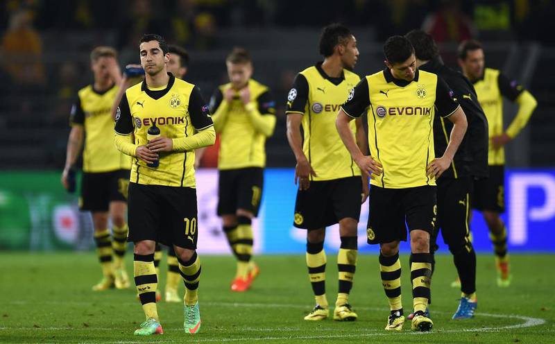 Borussia Dortmund players react after being eliminated from the Champions League on Tuesday. Patrik Stollarz / AFP / April 8, 2014