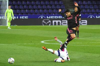 Real Madrid's Marco Asensio in action against Real Valladolid's Roque Mesa. EPA