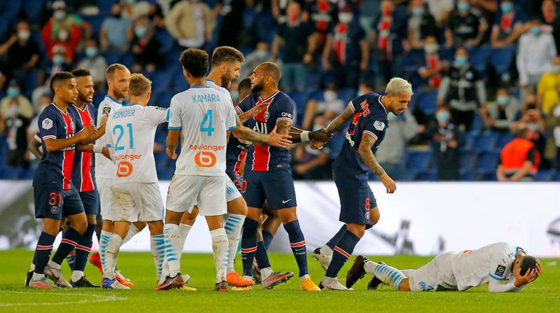 PSG and Marseille players clash near the end of the French League One match. AP