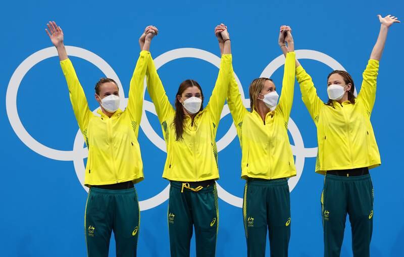 Emma McKeon, Meg Harris, Cate Campbell and Bronte Campbell of Australia celebrate on the podium after winning the Women's 4 x 100m Freestyle Relay.