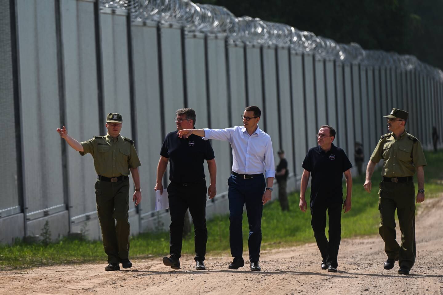 Prime Minister Mateusz Morawiecki visits the metal border wall. Getty Images