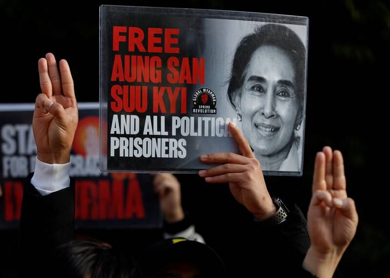 Myanmar protesters show off the portrait of Aung San Suu Kyi during a rally in Tokyo to mark the second anniversary of Myanmar's coup. Reuters
