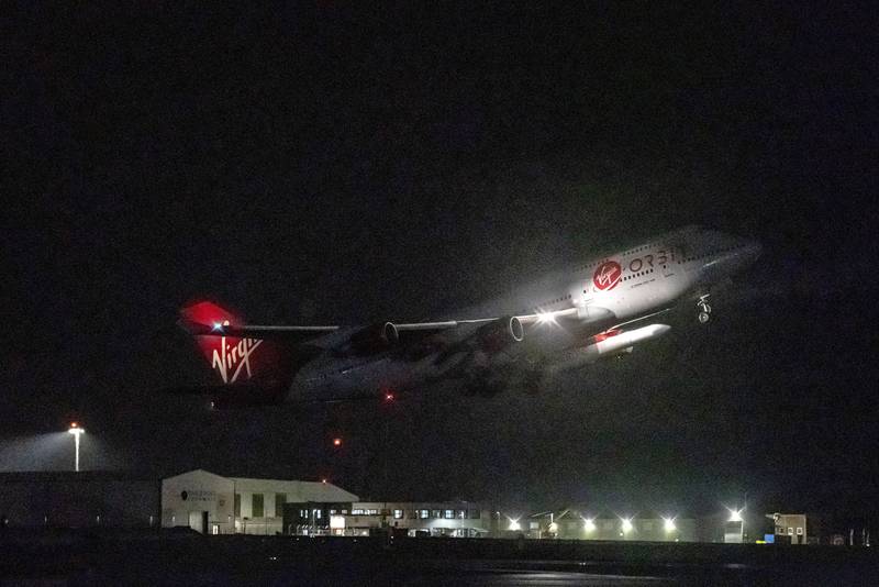 A repurposed Virgin Atlantic Boeing 747 aircraft carrying Virgin Orbit's LauncherOne rocket takes off from Spaceport Cornwall. AP