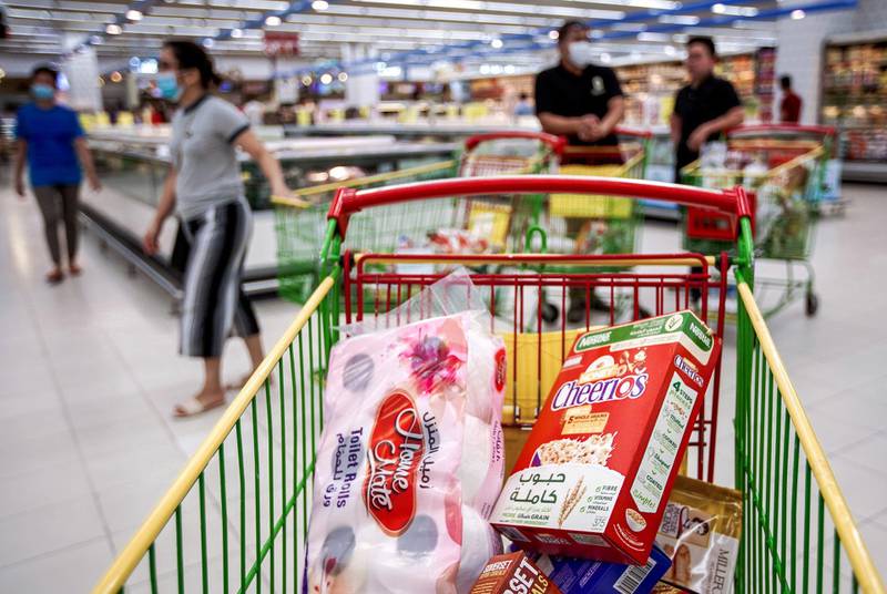 Abu Dhabi, United Arab Emirates, March 19, 2020.  A shopping cart with cereal and toilet rolls at the Lulu Hypermarket at Mushriff Mall during the Covid-19 pandemic.Victor Besa / The NationalReporter:   Dasn SandersonSection:  NA