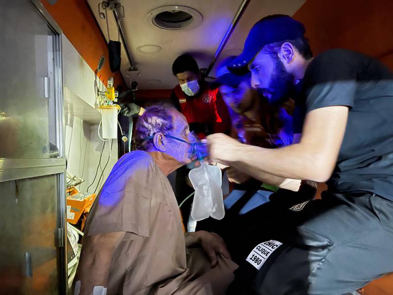 A Covid-19 patient is prepared for rescue in an ambulance outside Ibn Al Khateeb hospital in Baghdad. Reuters