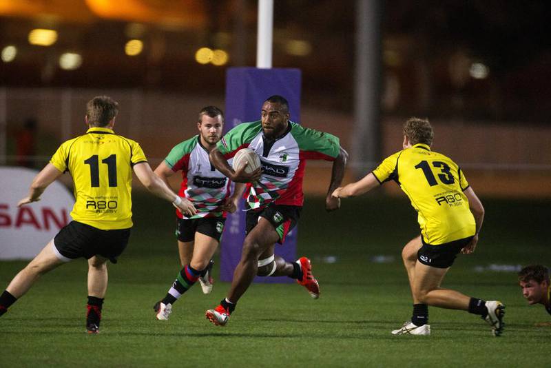 Abu Dhabi Harlequins, white, play Xodus Wasps Dubai, yellow, during their Nissan Rugby League Cup match at Zayed Sports City in Abu Dhabi on April 24, 2015. Christopher Pike / The National