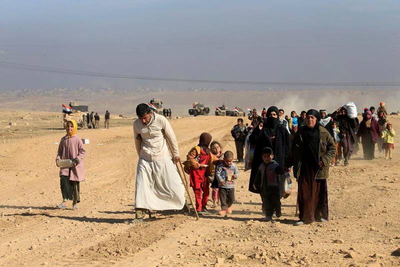 Displaced Iraqis flee their homes in western Mosul on February 25, 2017 as government forces battle with ISIL militants. Alaa Al Marjani / Reuters