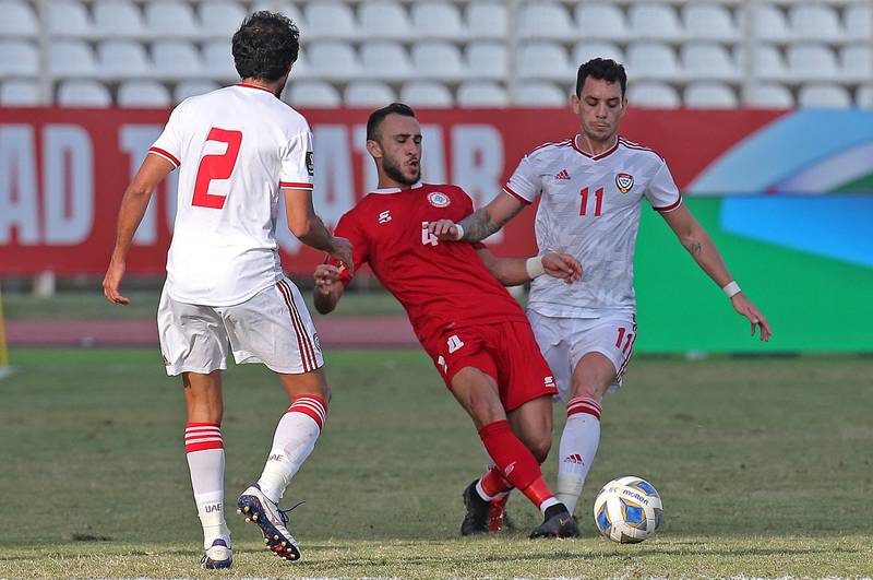 Lebanon defender Abbas Assi under pressure from UAE's Caio Canedo. AFP