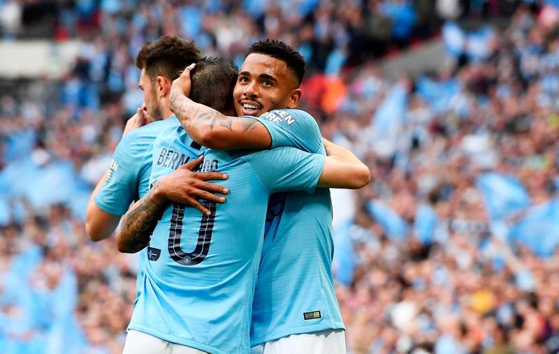 Gabriel Jesus, right, of Manchester City celebrates with teammates after scoring City's second. EPA