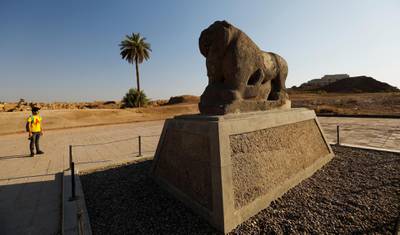 A man looks at the statue of the Lion of Babylon in the ancient city of Babylon near Hilla, Iraq.  Reuters