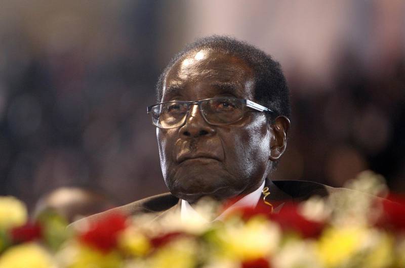 FILE - In this April 7,  2016 file photo Zimbabwean President Robert Mugabe attends a meeting with the country's war veterans in Harare.  Mugabe seemed almost untouchable for much of his nearly four-decade rule. Shrewd and ruthless, he managed to stay in power despite advancing age, growing opposition, international sanctions and the dissolving economy of a once-prosperous African nation. Now, the apparent abrupt end of the Mugabe era is launching Zimbabwe into the unknown. It's a humbling close to the career of a man who crushed dissent or sidelined opponents after leading Zimbabwe since 1980. (AP Photo/Tsvangirayi Mukwazhi, File)