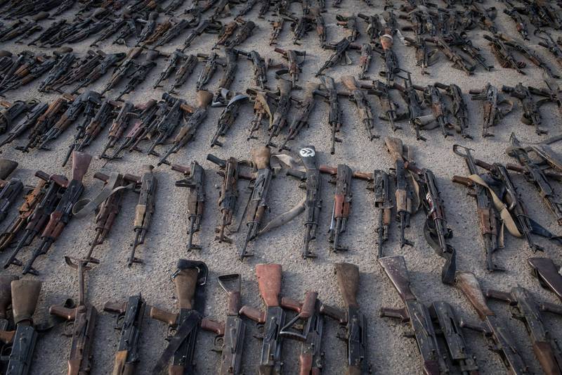Seized ISIS weapons that were found in the last stronghold of the extremist group are displayed at an SDF base outside Al Mayadin, Syria. Getty