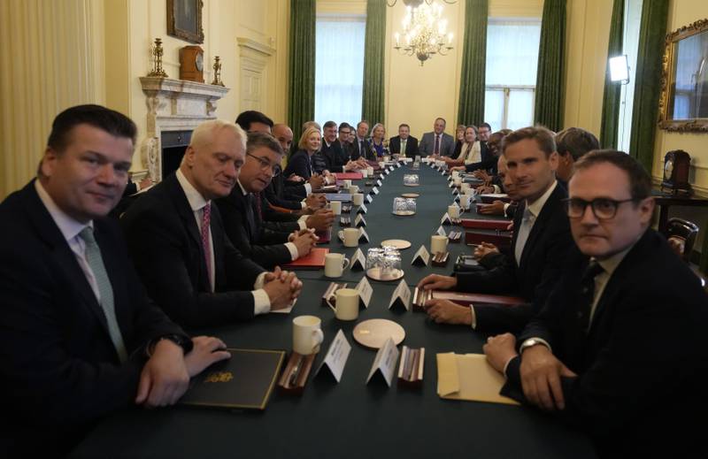 Graham Stuart, new Climate minister, sits second on left as British Prime Minister Liz Truss holds her first Cabinet meeting. AP