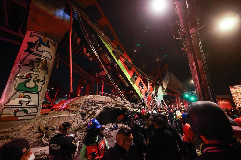 Emergency personnel search for survivors after a raised subway track collapsed in Mexico City. Getty