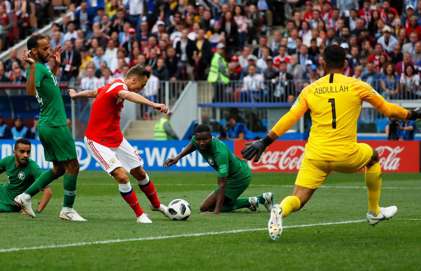 epa06807438 Denis Cheryshev (C-L) of Russia scores the 2-0 lead against Saudi Arabia's goalkeeper Abdullah Almuaiouf (R) during the FIFA World Cup 2018 group A preliminary round soccer match between Russia and Saudi Arabia in Moscow, Russia, 14 June 2018.

(RESTRICTIONS APPLY: Editorial Use Only, not used in association with any commercial entity - Images must not be used in any form of alert service or push service of any kind including via mobile alert services, downloads to mobile devices or MMS messaging - Images must appear as still images and must not emulate match action video footage - No alteration is made to, and no text or image is superimposed over, any published image which: (a) intentionally obscures or removes a sponsor identification image; or (b) adds or overlays the commercial identification of any third party which is not officially associated with the FIFA World Cup)  EPA/YURI KOCHETKOV   EDITORIAL USE ONLY