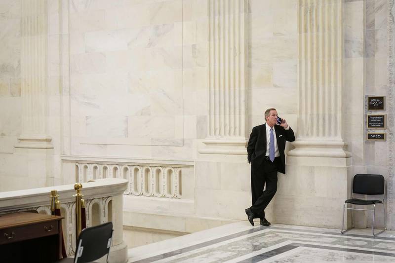 Michael van der Veen, former President Donald Trump's defense lawyer, speaks on the phone following the conclusion of the second impeachment trial of former President Donald Trump at the U.S. Capitol  in Washington, DC. The Senate voted 57-43 to acquit Trump. AFP
