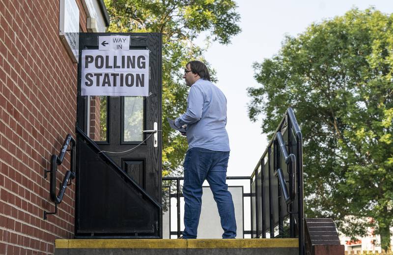 A voter arrives at a polling station in Wakefield. PA