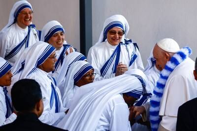 Pope Francis greets nuns as he arrives to meet people suffering economic hardship at the House of the Missionaries of Charity in Marseille. EPA