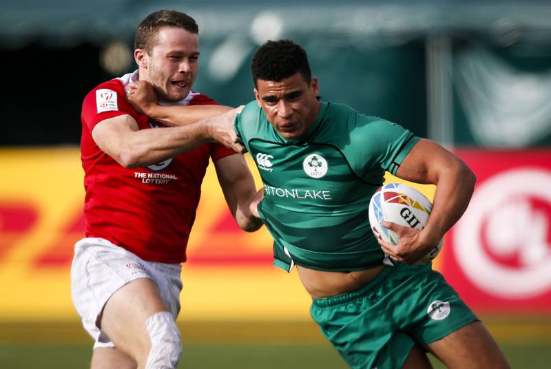 Ireland's Jordan Conroy, right, fends off Britain's Robbie Fergusson during an HSBC Canada Sevens rugby match in Edmonton, Alberta, Saturday, September  25, 2021. The Canadian Press