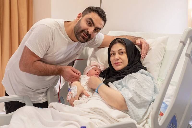 Syrian couple Reem Al Saleh and Yousif Ali Al Hussain with their eighth child Emarat. Photo: Burjeel Hospital
