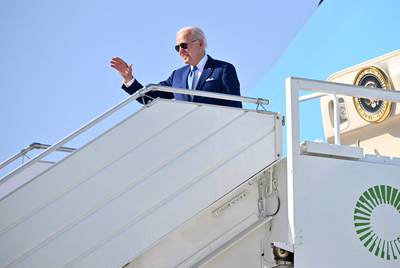 US President Joe Biden boards a plane at King Abdulaziz International Airport in Jeddah. AFP