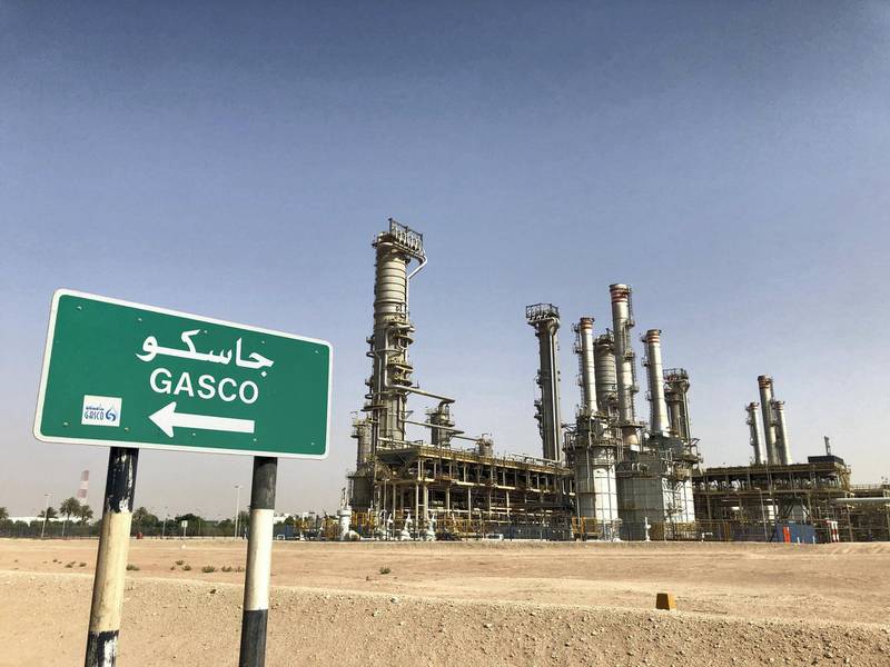 A sign displaying the old name of Adnoc's gas processing plant at Ruwais refinery. Jennifer Gnana / The National