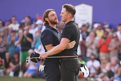 Tommy Fleetwood of England and Matt Wallace of England embrace on the 18th green after finishing their final round. Getty Images