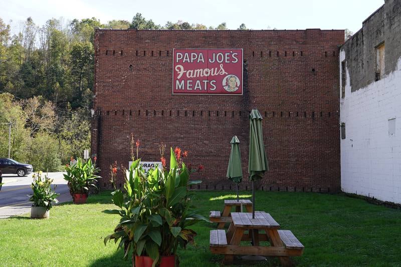 A sign for "Papa Joe's famous meats" still hangs on the exterior of a building in Farmington, West Virginia. Willy Lowry / The National