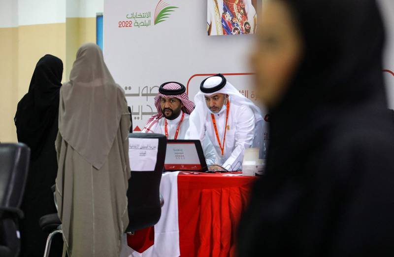 Bahraini women register to vote at a polling station on the island of Muharraq, north of the capital Manama, during parliamentary elections, on November 12, 2022.  - More than 330 candidates, including a record 73 women, are competing to join the 40-seat council of representatives, the lower house of parliament that advises King Hamad bin Isa Al-Khalifa, who has ruled since his father died in March 1999.  (Photo by AFP)