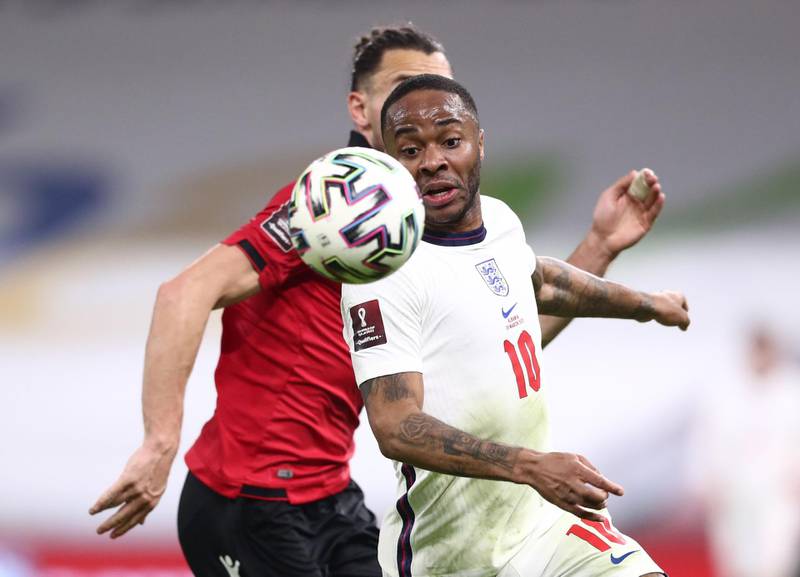 England's Raheem Sterling in action with Albania's Frederic Veseli. Reuters