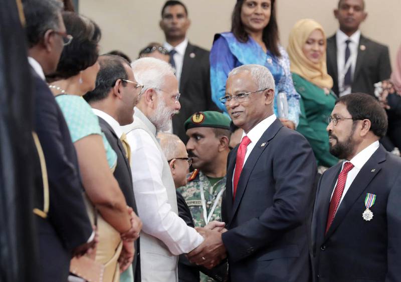 Indian Prime Minister Narendra Modi, center left, congratulates Maldives' new President Ibrahim Mohamed Solih after his swearing-in ceremony in Male, Maldives, Saturday, Nov. 17, 2018. Thousands of people cheered Solih, from the Maldivian Democratic Party, at a swearing-in ceremony Saturday in a soccer stadium chosen to accommodate a large number of his supporters. (AP Photo/Mohamed Sharuhaan)