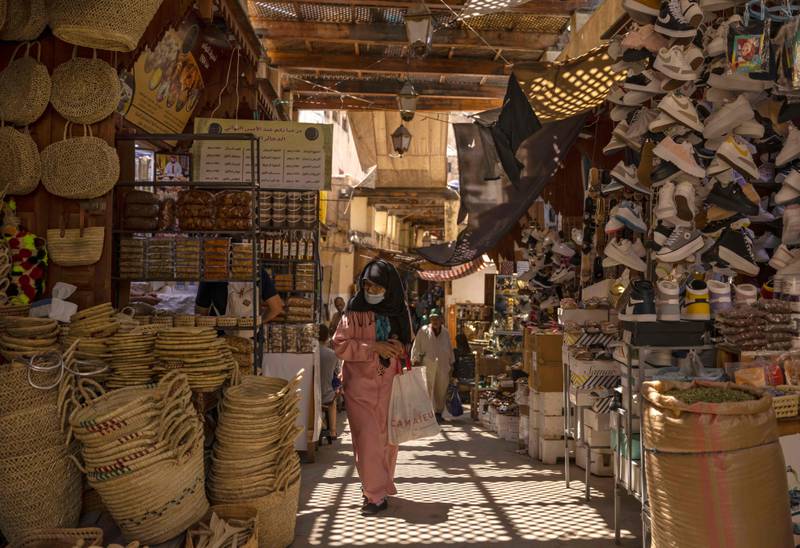 A woman walks past shops in the ancient Moroccan city of Fez. Today, Fez serves as a monument to a highpoint of Islamic civilisation, the 13th and 14th centuries when Muslim rulers governed from Morocco to western China. AFP
