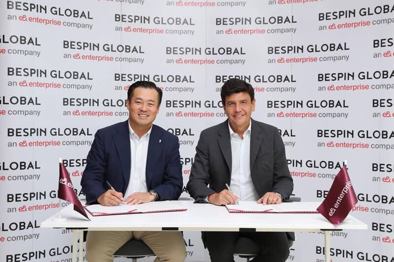Salvador Anglada, chief executive of e& enterprise, right, and John Hanjoo Lee, chief executive and co-founder of Bespin Global, during the signing ceremony. Photo: e&