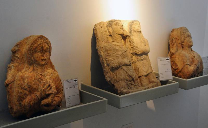 In this photo released by the Syrian official news agency SANA, antiquities are displayed during the reopening ceremony for Syria's National Museum, in Damascus, Syria, Sunday, Oct. 28, 2018. Syrian officials, foreign archeologists and restoration specialists attended the Sunday reopening ceremony in the heart of Damascus more than six years after the prominent institution was shut down and emptied as the country's civil war encroached on the capital. (SANA via AP)