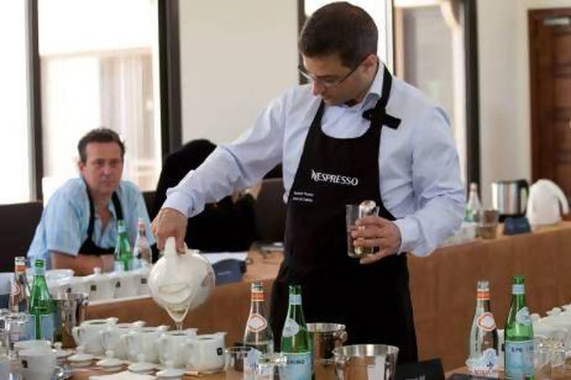 Edouard Thomas, Atelier de Creation pours hot water in different single origin coffees at the Nespresso Chef Academy Program at the Emirates Academy for Hospitality. Razan Alzayani / The National